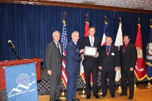 Representatives from associations sponsoring the November luncheon are (l-r) Brian Binn, president of military affairs for the Greater Colorado Springs Chamber of Commerce; Col. Philip Platt, USAF, chapter president; Bach; Dave Shiller, vice president for the Lance P. Sijan Chapter of the Air Force Association; and Joe Kahoe, treasurer of the National Defense Industrial Association Rocky Mountain Chapter.